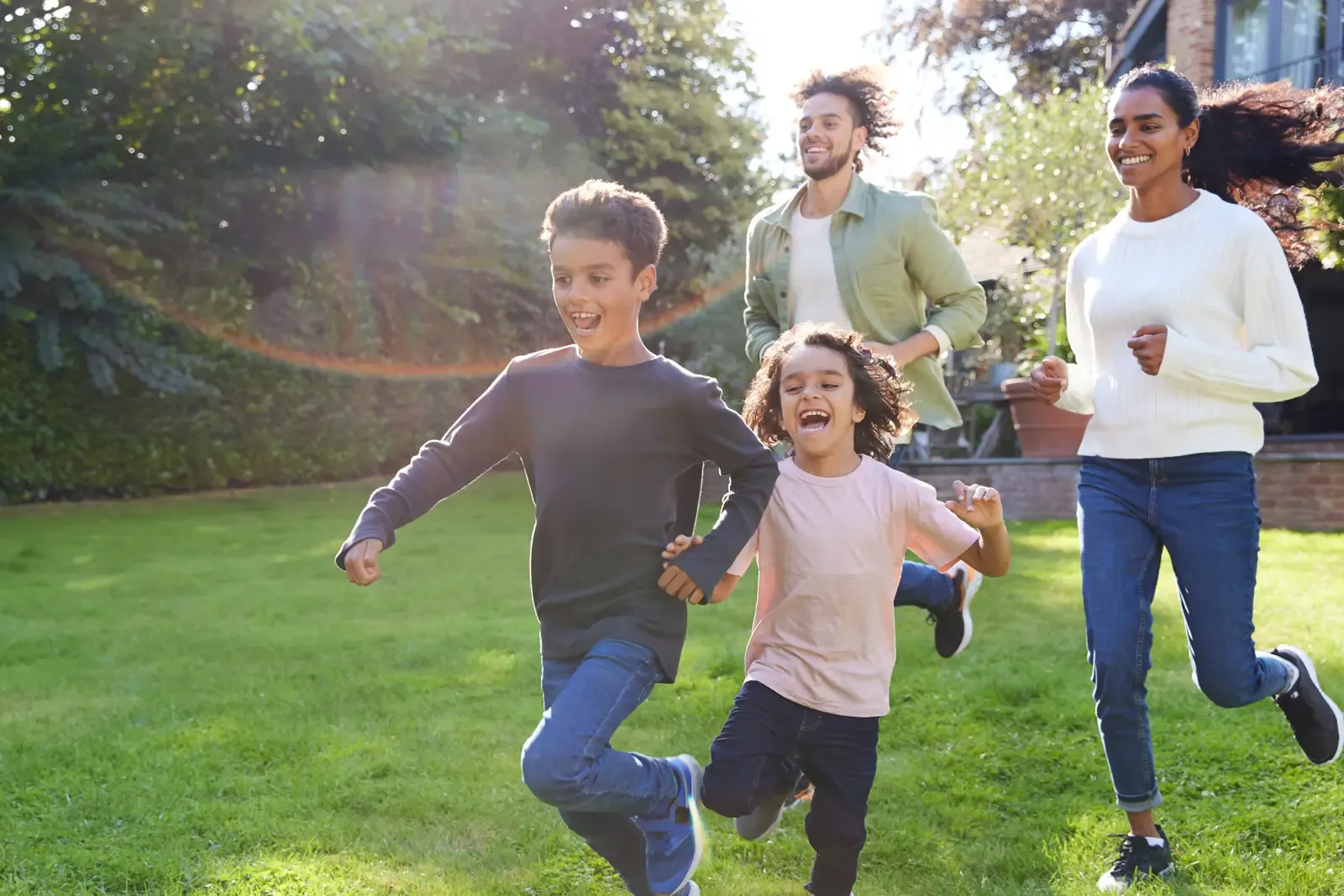 family running on lawn